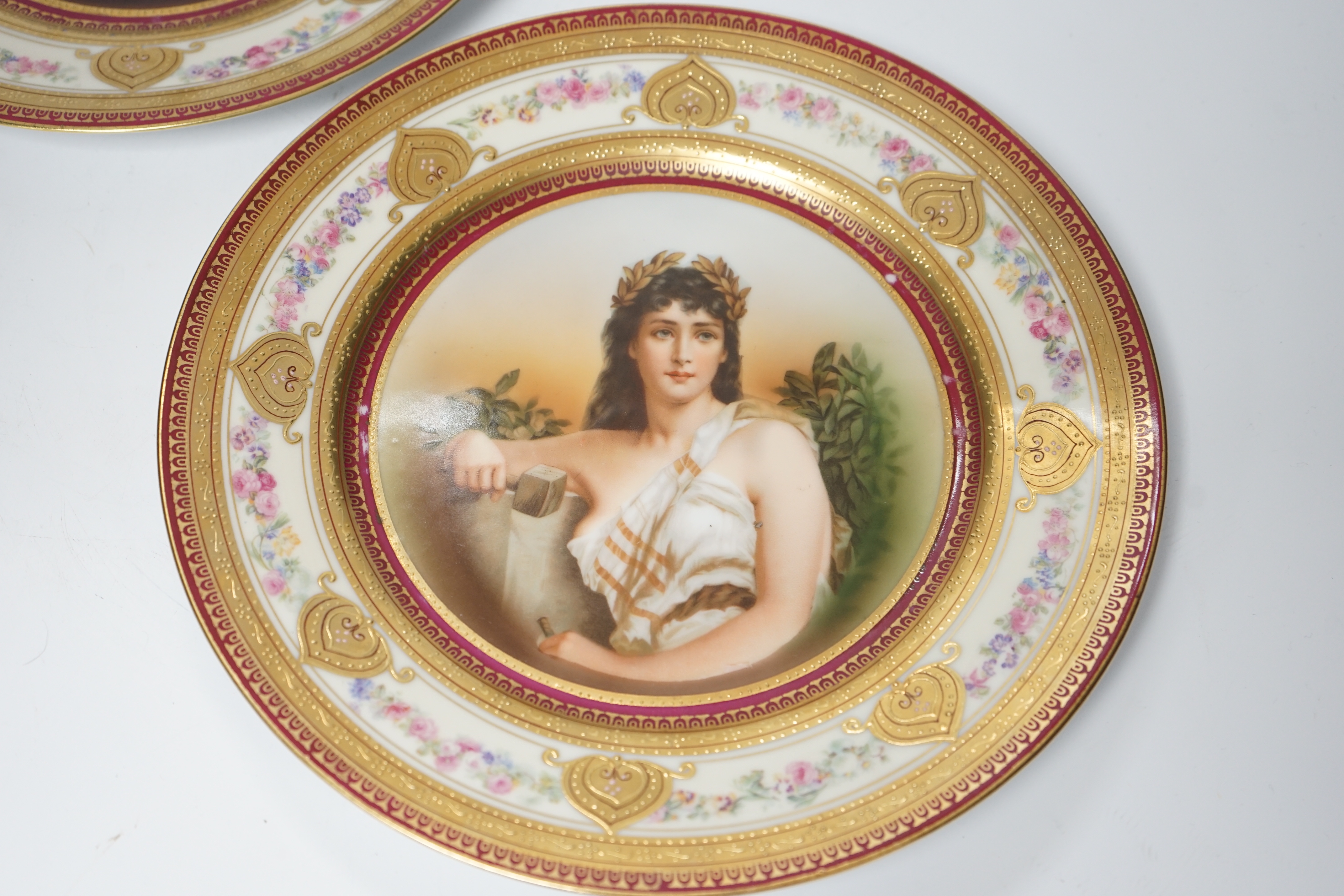 A pair of early 20th century Schwarzburg cabinet plates, a mason and a harpist, 26cm